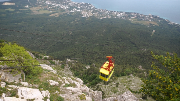 The Cable Car In Crimea Ai-Petri On a Background Of Mountains Covered With Clouds
