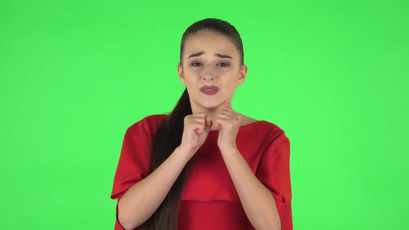 Portrait of Pretty Young Woman Is Looking at Camera with Anticipation, Then Very Upset. Green Screen