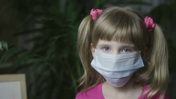 The Child Is Put on a Medical Mask.