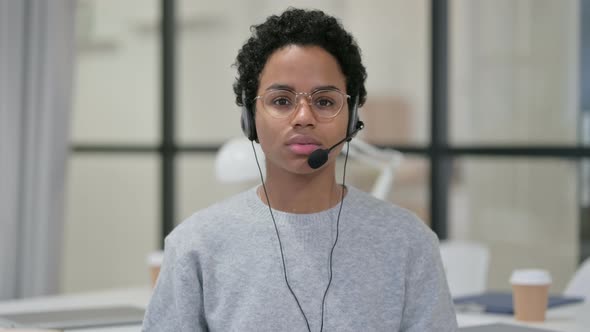 Portrait of African Woman Wearing Headset with Mic 