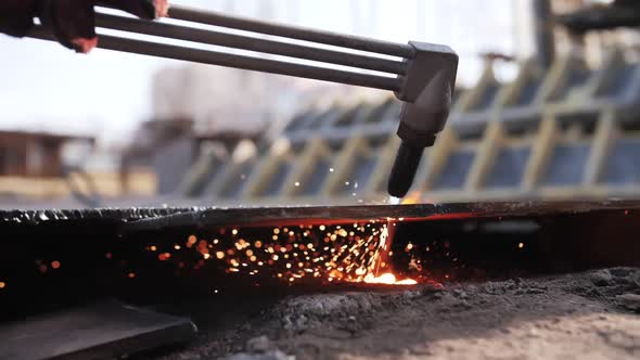 gas cutting of metal, sparks fly