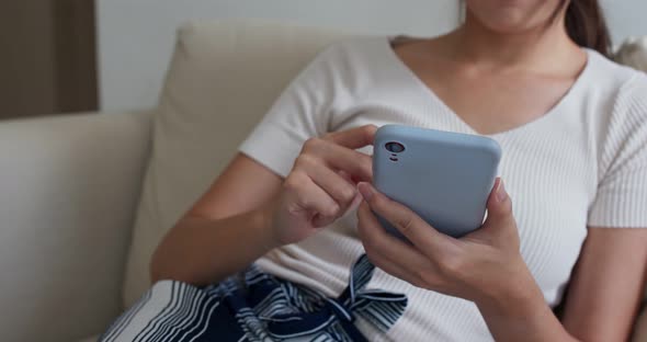 Woman use of smart phone at home