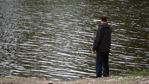 Fisherman is Fishing on the River