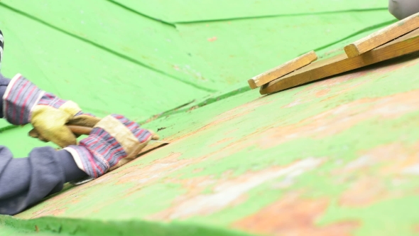 Woman Sitting Next To The Ladder, Scraping Paint