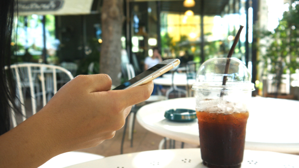 Using Smartphone In coffee Shop