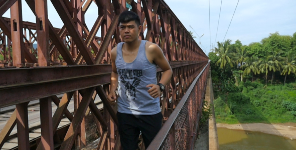 Man Running On The Steel Bridge