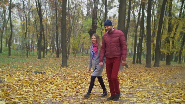 Affectionate Couple on Romantic Date in Autumn Park