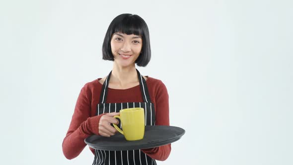 Smiling waitress holding a tray of coffee cup against white background 4K 4k