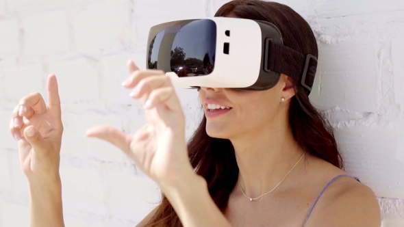 Young Woman Wearing Virtual Reality Goggles