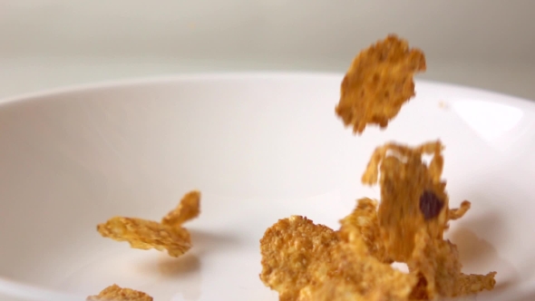 Super  Shot Of Corn Flakes With Dried Fruits And Raisin Fall On Plate
