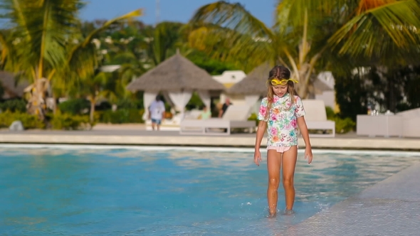 Little Adorable Girl In Outdoor Swimming Pool