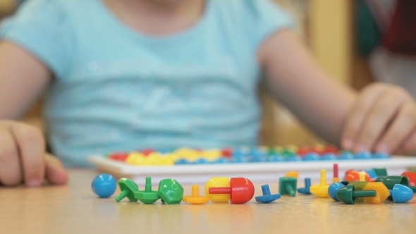 Little Girl Plays a Intellectual Educational Game