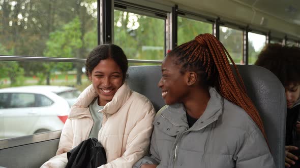 Multiethnic Shoolchildren Chatting on School Bus