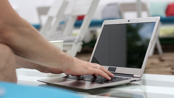 Man Typing On Laptop