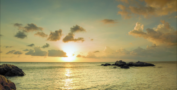 Sunset On Sea With Stones