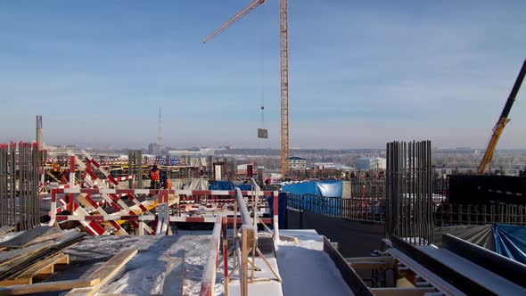 Various Work Scenes During Day at Stadium Construction Site