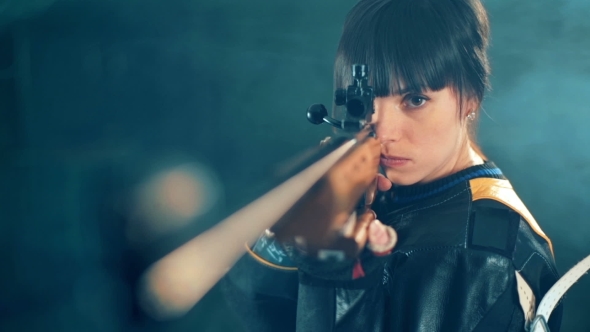 Girl Shooting From a Rifle