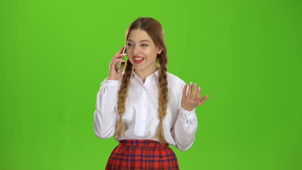 Teen Is Talking on the Phone. Green Screen