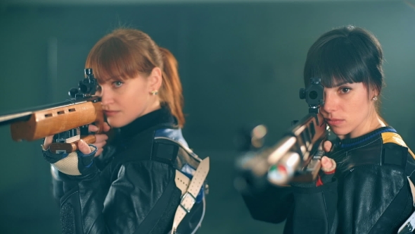 Women Shooting With Rifle
