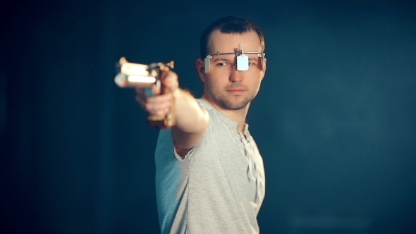 Man Shooting With Gun At a Target