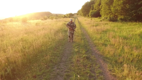 Aerial View: Military With Automaton Running In The Forest