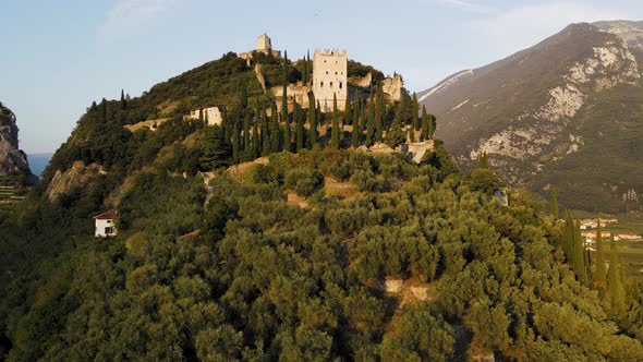 Aerial View of Arco Castle. Medieval Buildings Above Riva Del Garda City, Italy, Trento Province. Hi
