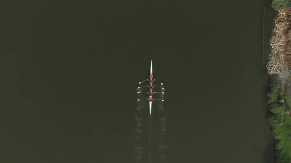 Sport canoe team rowing in a river, Drone footage.