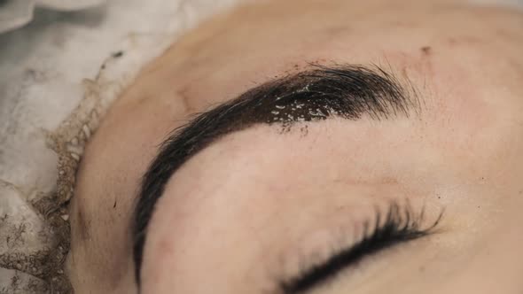 Beautician, Specialist of Permanent Make-up Making Eyeliner Permanent Make Up