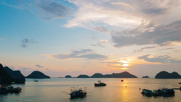 Time lapse: Vietnam Cat Ba bay at sunset to night with floating fishing boats on sea