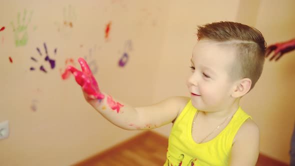 Cute Boy Showing His Hands in Paint