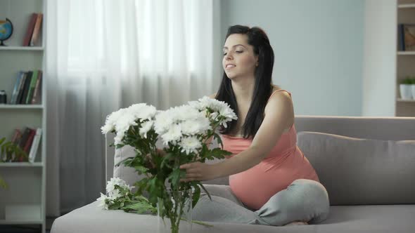 Lovely Pregnant Girl Decorating House With Nice Flowers, Aesthetic Enjoyment