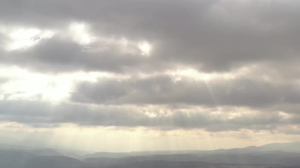 Dramatic cloudscape with rays of sun 4K aerial footage
