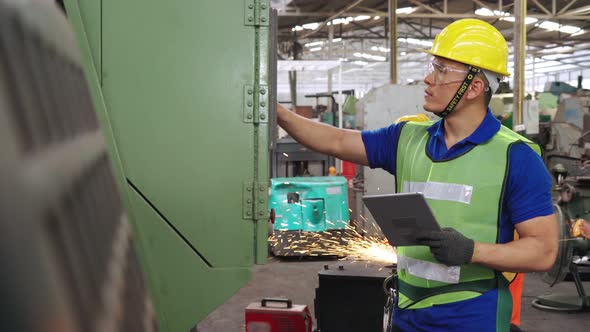 Smart Factory Worker Using Machine in Factory Workshop