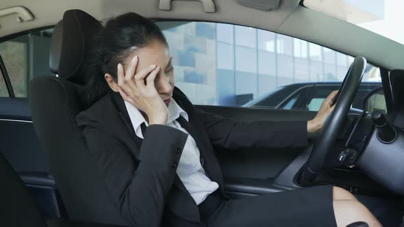 Biracial Woman in Suit Sitting in Auto, Hitting Steering Wheel, Annoyance