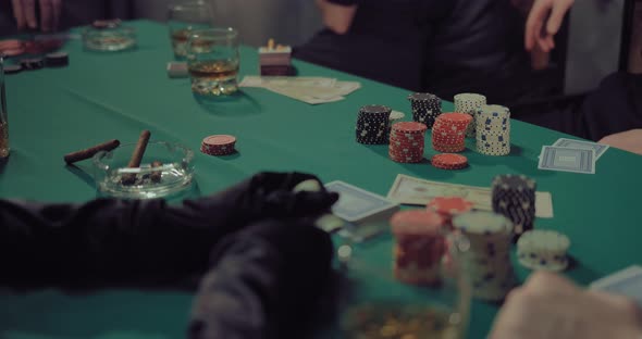 Players Make Bets in Poker Put Chips on the Table