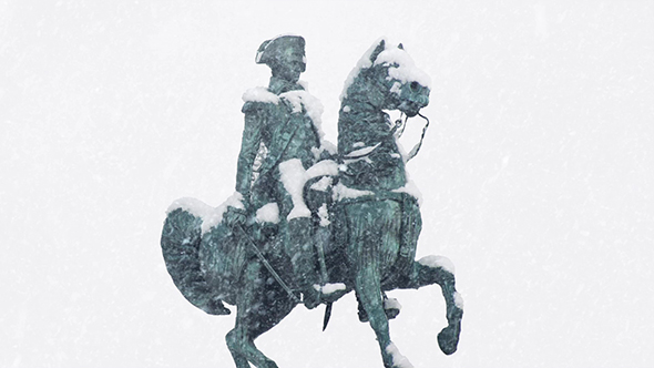 Statue Of Man On Horse In Snowfall