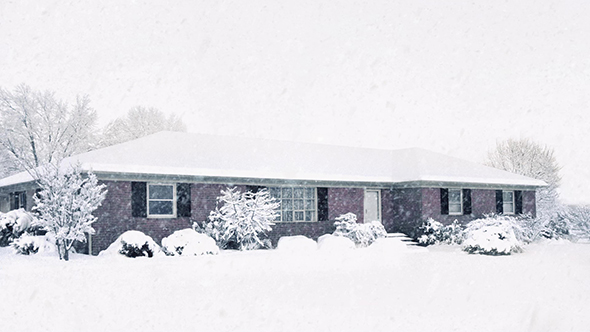 House Blanketed In Snow In Blizzard alt