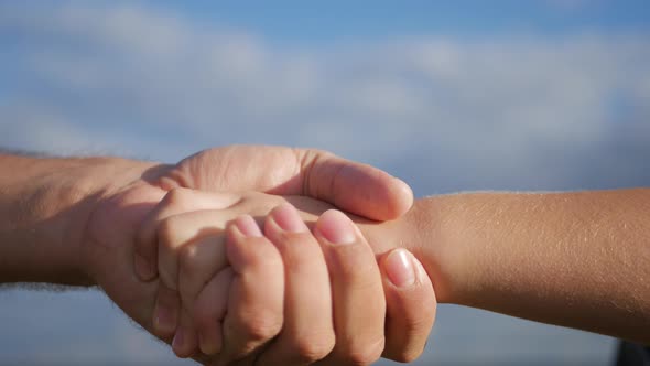 Parent Holds the Hand of a Small Child Hand of Kid or Child and Parent or Mother Show Love