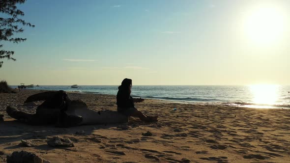 Tourist suntans on tranquil resort beach vacation by blue ocean with white sand background of the Ma