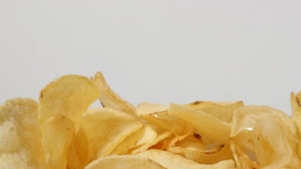 Fresh slices of fried potato chips for youth in a bowl popular appetizer 4K 3840X2160 UltraHD footag