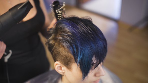 The Girl With Blue Hair In a Beauty Salon.