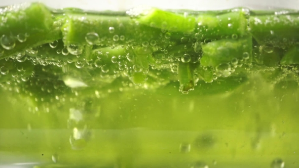 Green Beans In Boiling Water In a Glass Pan