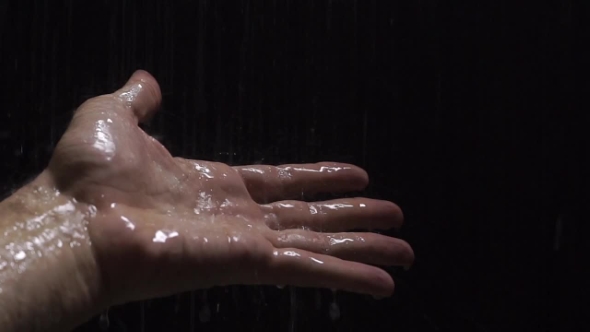 Man Hand Under The Shower With Black Background