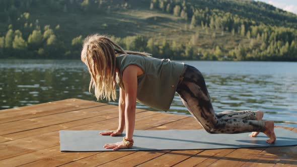 Young Woman Having Yoga Workout in Nature