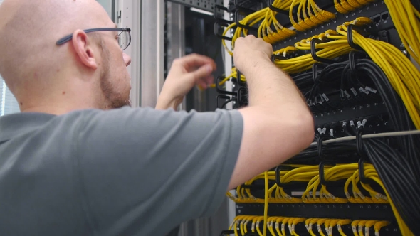 IT Engineer Paves The Yellow Ethernet Cable