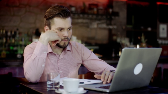 Young Business Men Is Working In a Bar