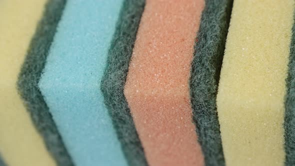 Colorful dish sponges in a row 4K panning video