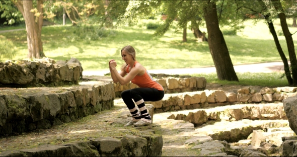 Young Girl Exercising in the Park.