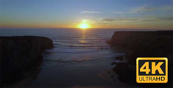 Aerial drone footage of sunset on a cliff with beach in Alentejo, Portugal 2