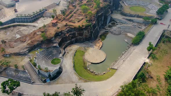 Outdoor amphitheater and pond by Breksi Cliff in Yogyakarta, Indonesia